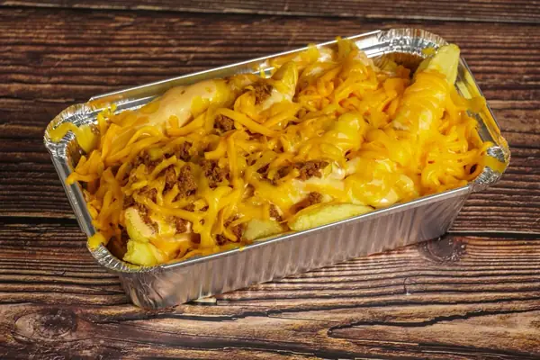 A tray of chips covered in melted cheese